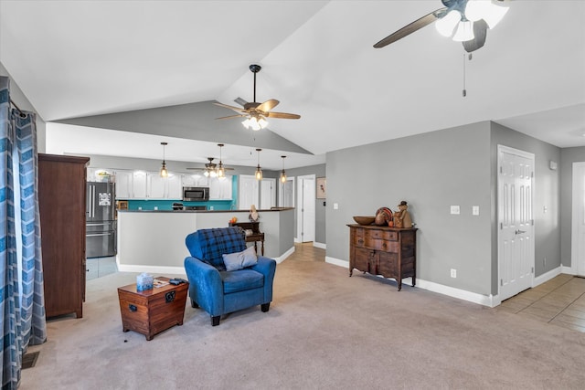 living area with ceiling fan, light carpet, and lofted ceiling