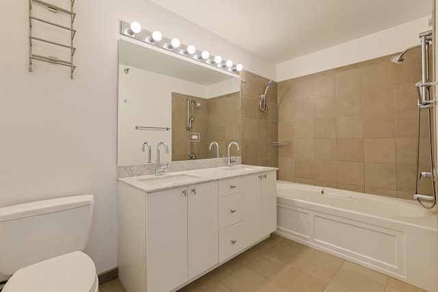 full bathroom with tile patterned floors, vanity, toilet, and tiled shower / bath combo