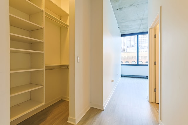 corridor featuring hardwood / wood-style floors