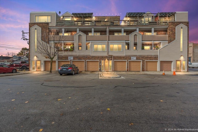 view of outdoor building at dusk