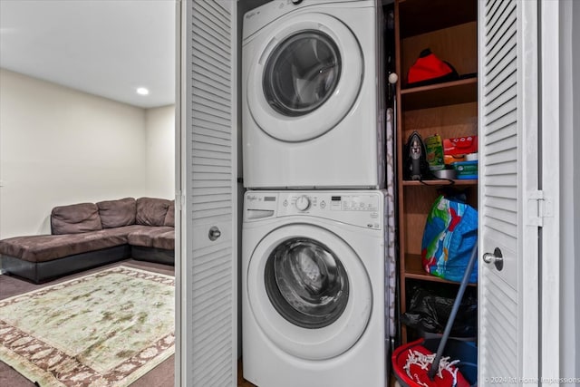 laundry room with stacked washer / drying machine