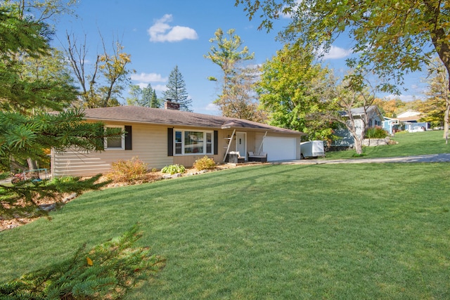 ranch-style home featuring a garage and a front yard