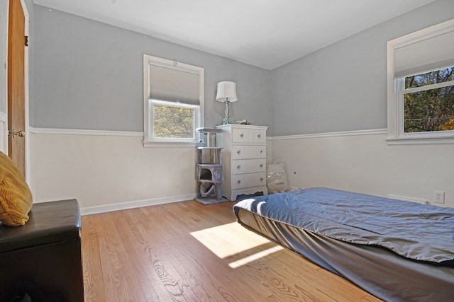 bedroom with light hardwood / wood-style floors