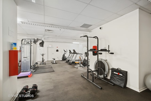 workout area with a drop ceiling