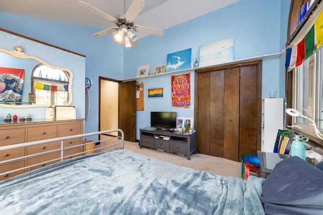 carpeted bedroom with a high ceiling