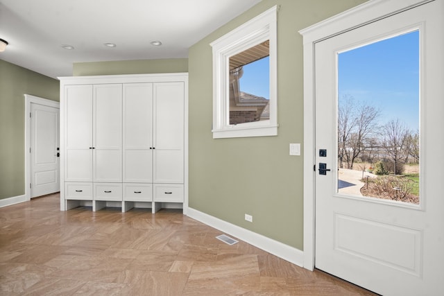 doorway to outside featuring a wealth of natural light