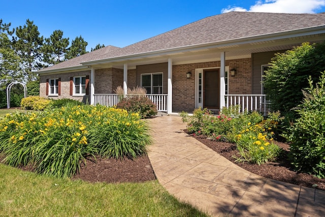 single story home featuring covered porch