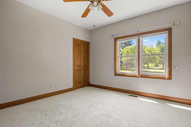 spare room with carpet and ceiling fan