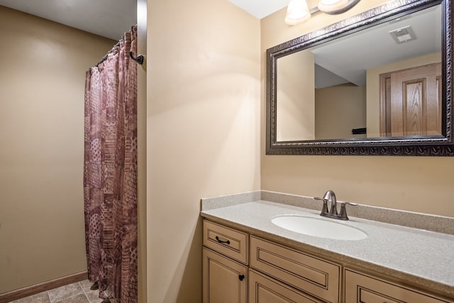 bathroom with vanity and tile patterned flooring