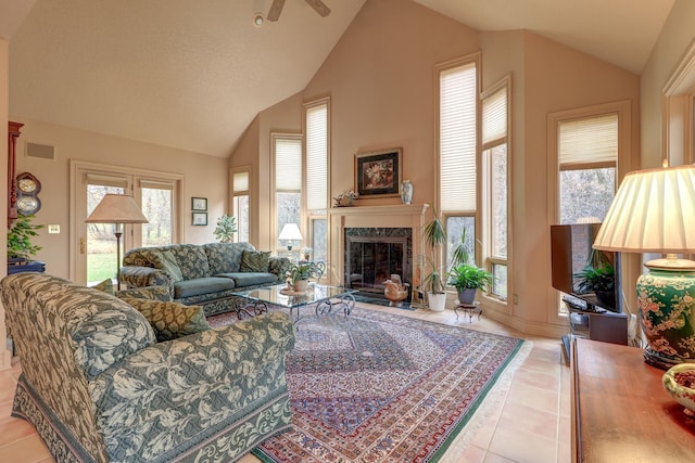 17619 Grandview Dr, Sterling, IL 61081 - living room featuring lofted ceiling, tile patterned floors, a fireplace, a ceiling fan, and baseboards