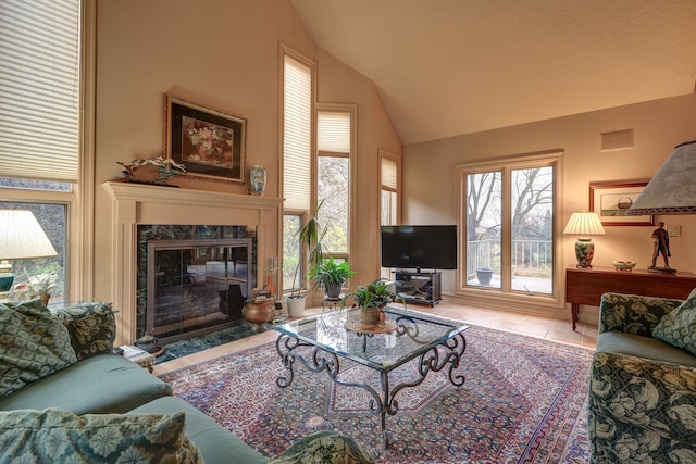 tiled living room with a premium fireplace and vaulted ceiling