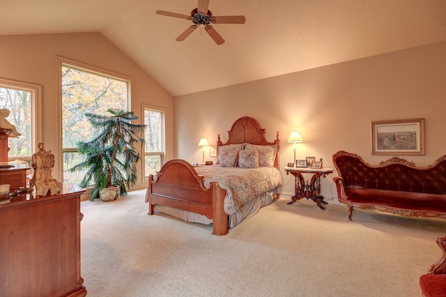 carpeted bedroom featuring ceiling fan and vaulted ceiling