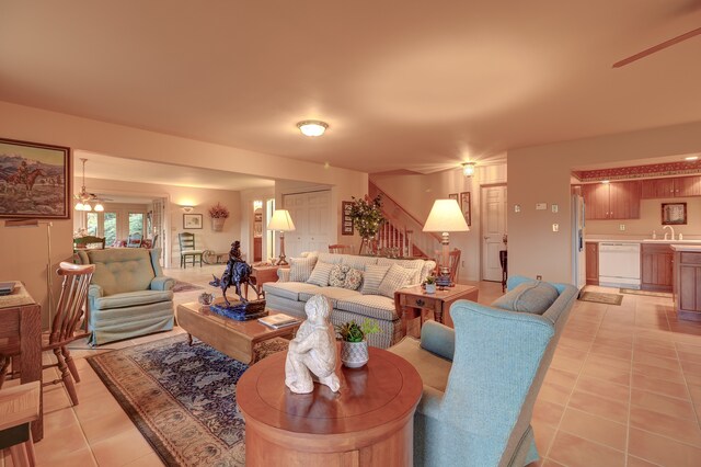 tiled living room featuring ceiling fan