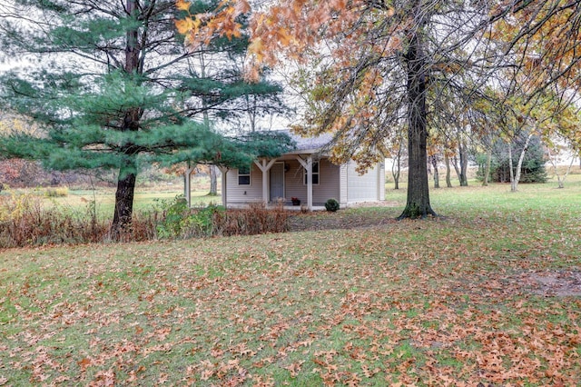 17619 Grandview Dr, Sterling, IL 61081 - view of green lawn with an attached garage and a porch