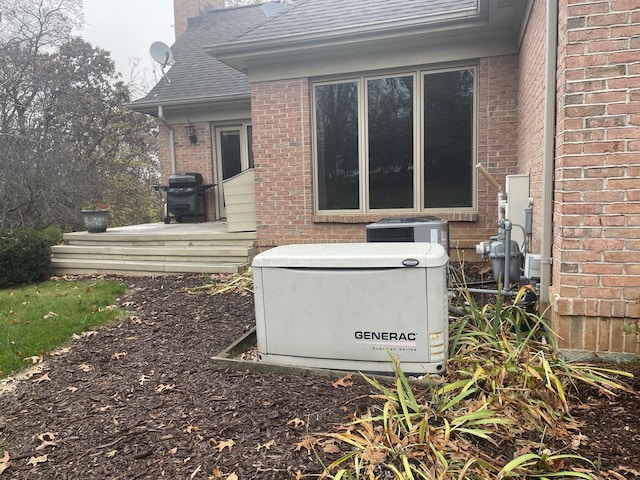 17619 Grandview Dr, Sterling, IL 61081 - exterior view of a power unit, brick siding, central air condition unit, roof with shingles, and gutters