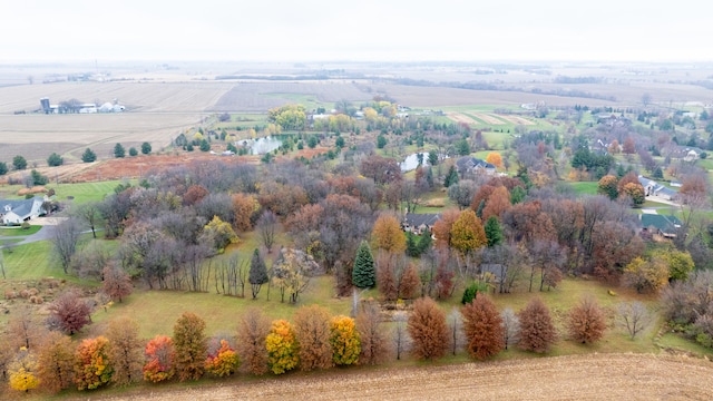 birds eye view of property with a rural view