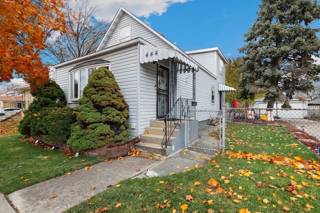 bungalow-style house featuring a front yard