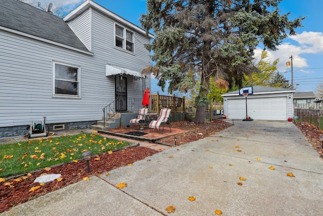 view of patio featuring a garage and an outdoor structure