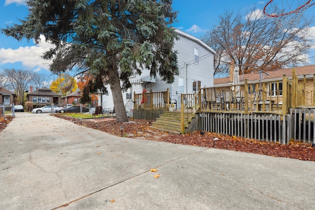 view of front of home featuring a wooden deck