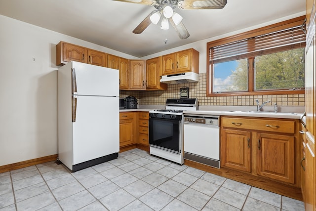 kitchen featuring white appliances, backsplash, sink, ceiling fan, and light tile patterned floors