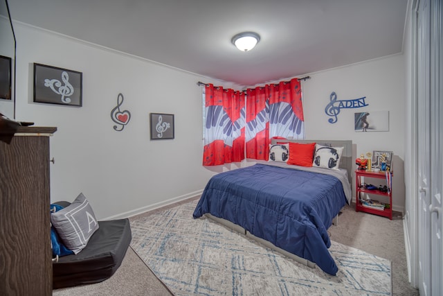 carpeted bedroom featuring crown molding