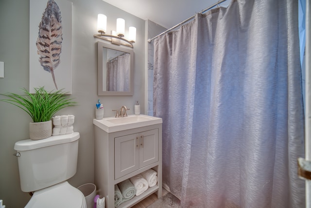 bathroom featuring vanity, hardwood / wood-style flooring, toilet, and a shower with shower curtain