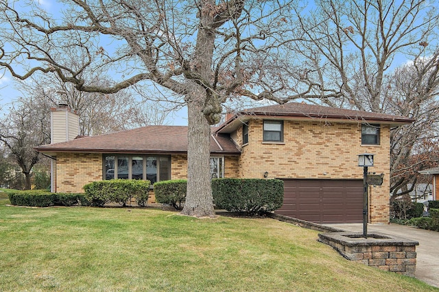 tri-level home featuring a garage and a front yard