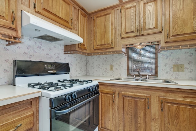 kitchen featuring sink and white gas stove