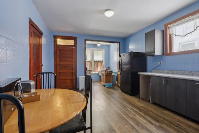 dining area featuring dark wood-style flooring