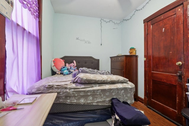 bedroom with wood finished floors