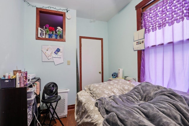 bedroom with wood finished floors