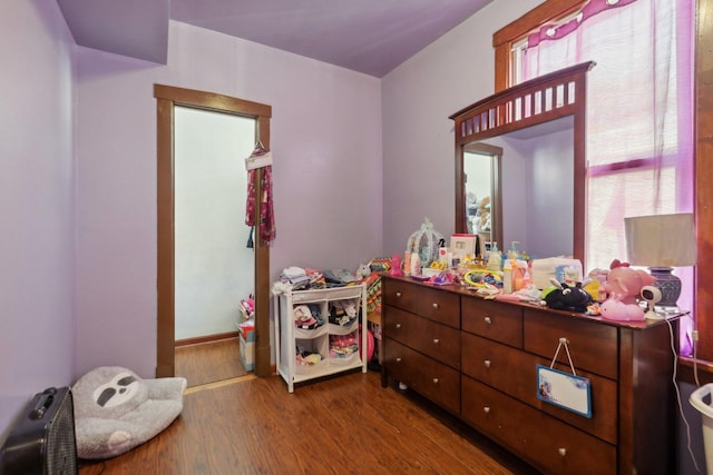 bedroom featuring wood finished floors