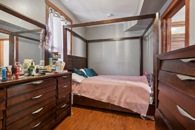 bedroom featuring wood finished floors