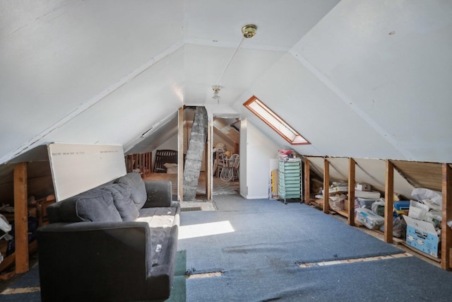 additional living space featuring lofted ceiling with skylight