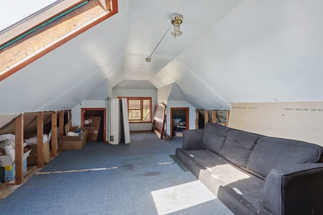 living area with lofted ceiling and carpet flooring