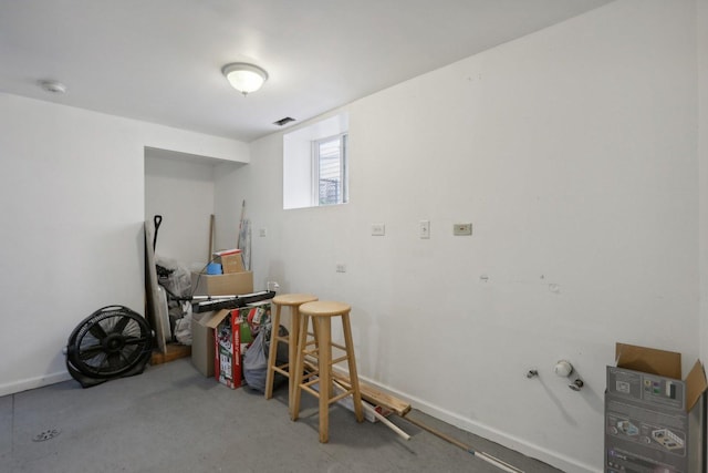 interior space with baseboards and visible vents