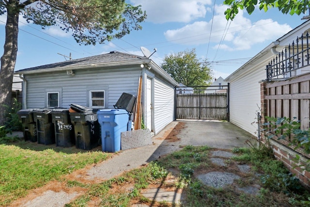 view of side of home with fence