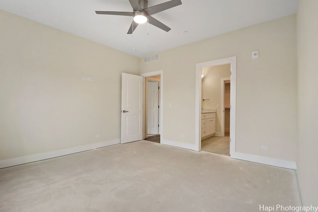 unfurnished bedroom with ceiling fan and connected bathroom