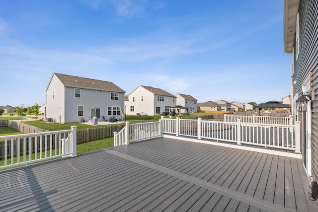 wooden deck with a yard and a gazebo