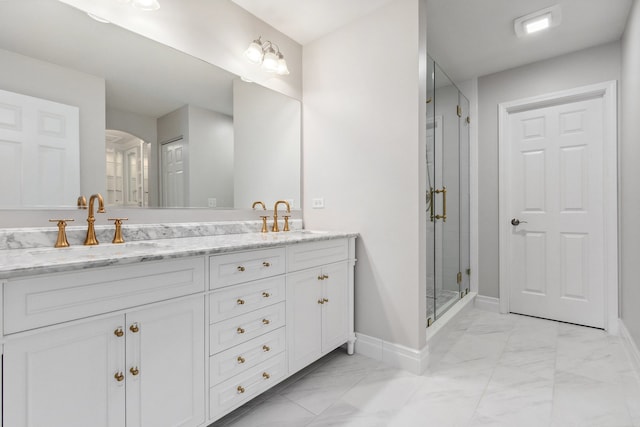 bathroom featuring vanity and a shower with door