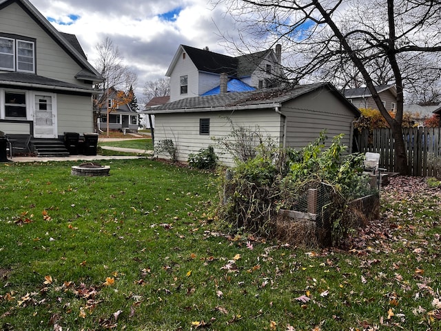 view of yard with an outdoor fire pit