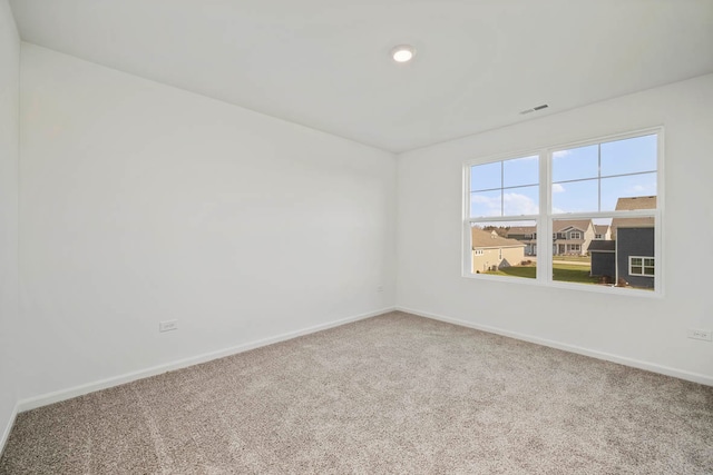 empty room featuring carpet flooring