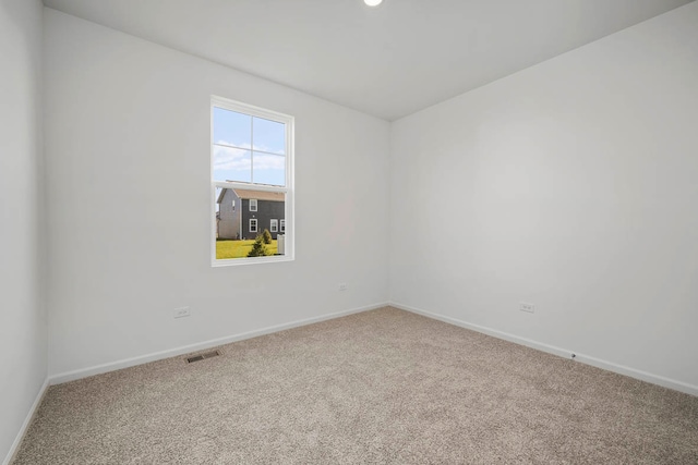 spare room with carpet floors