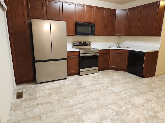 kitchen featuring sink and black appliances