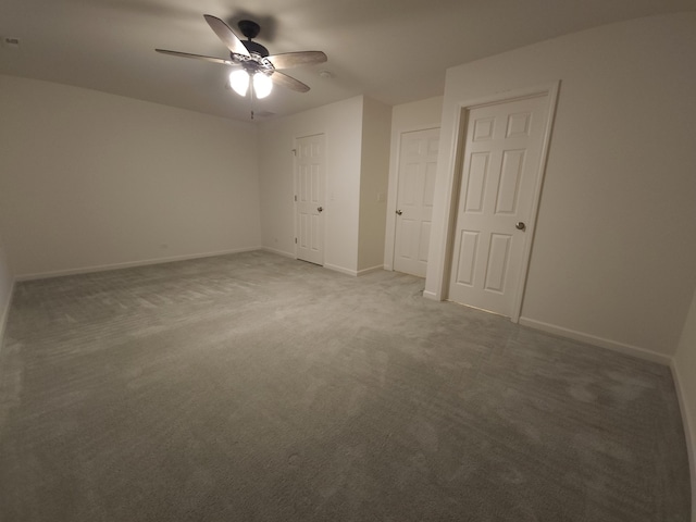 unfurnished bedroom featuring ceiling fan and carpet floors