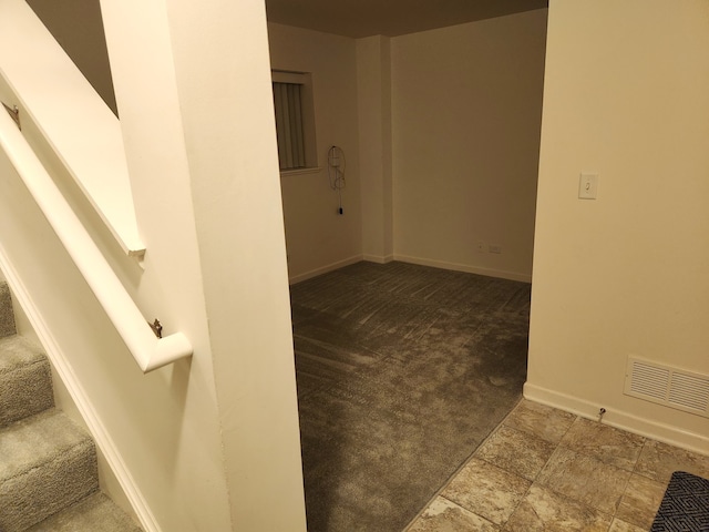 unfurnished room featuring carpet flooring