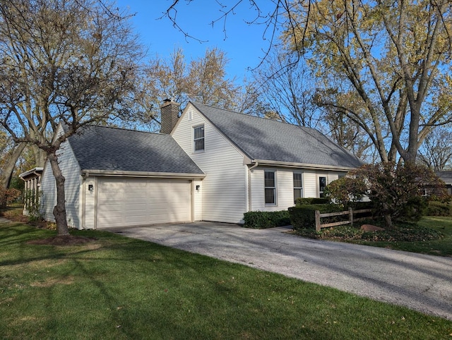 view of property exterior featuring aphalt driveway, roof with shingles, a chimney, a lawn, and a garage