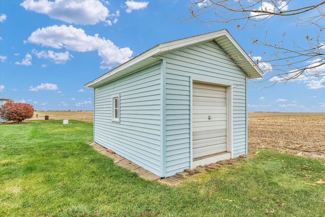 view of outdoor structure with a lawn