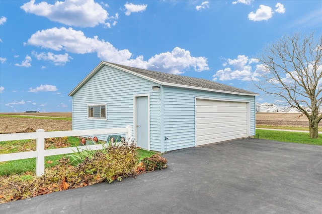 garage featuring a rural view