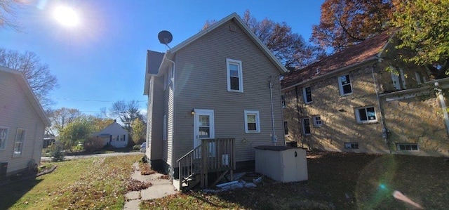 back of house with a yard